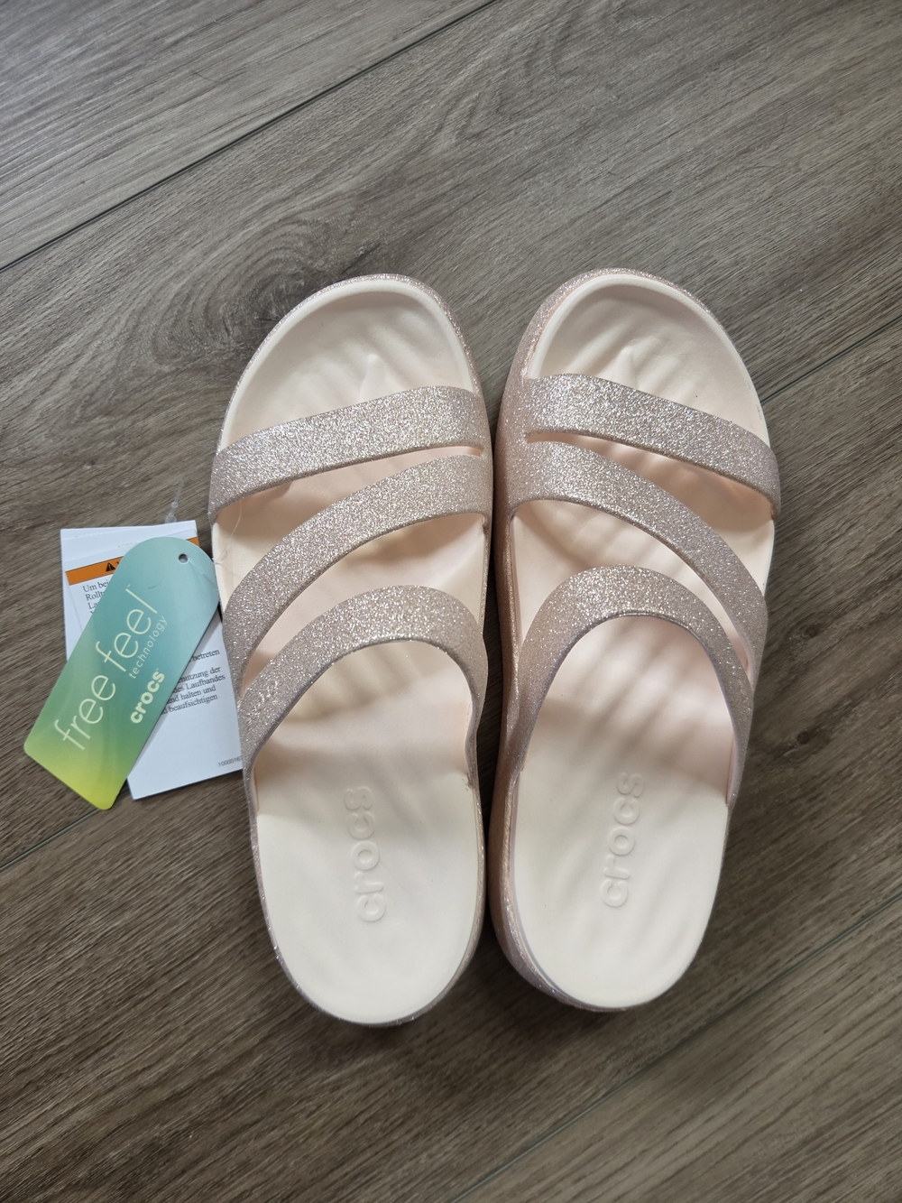 CROCS Womenโs Rose Gold Glitter Slide Sandals